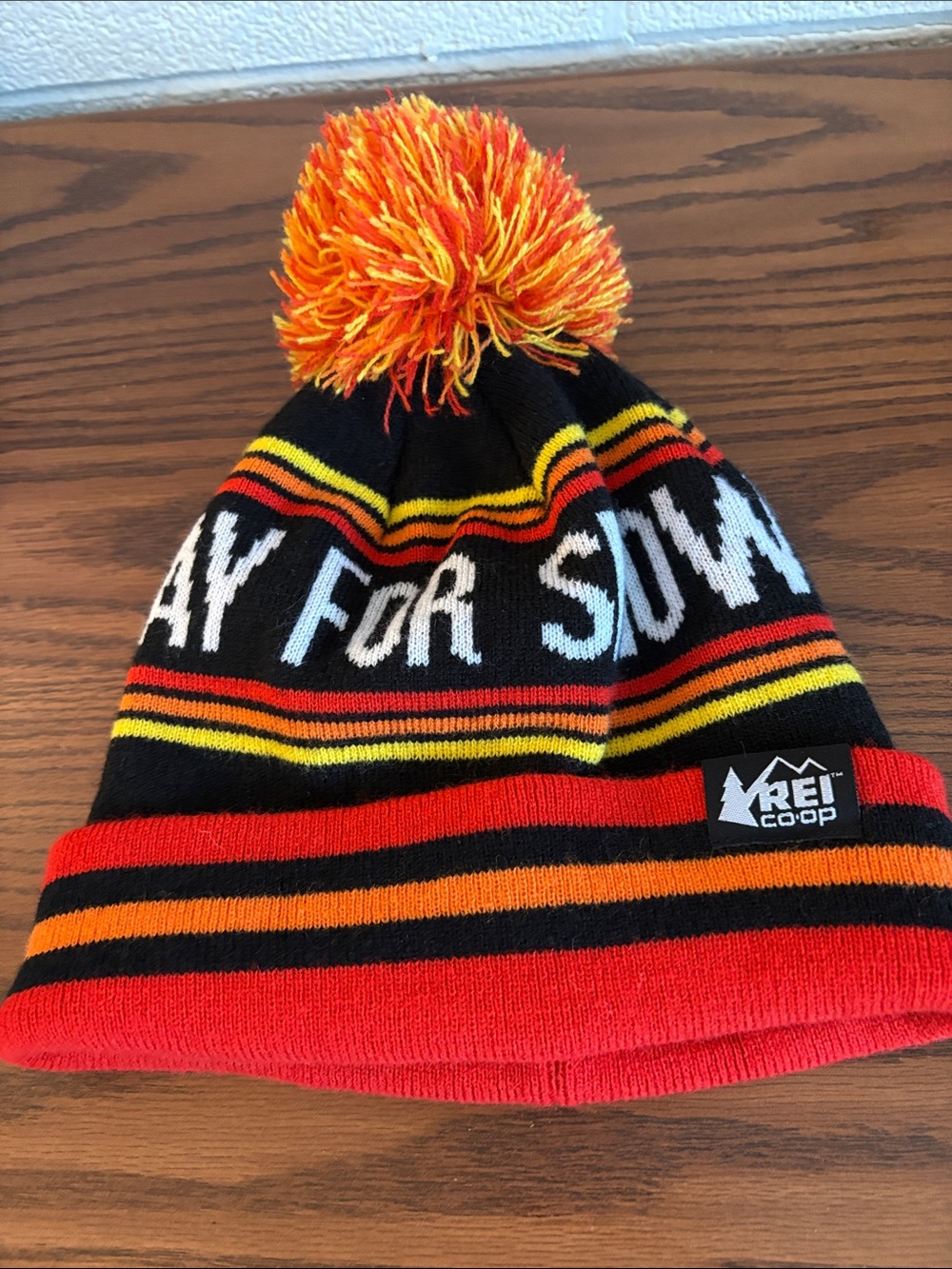 REI Black Beanie with Red, Orange & Yellow Stripes and Pom